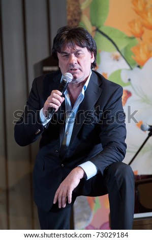 MOSCOW - MARCH 5: Russian singer Alexander Serov at a concert dedicated to the International Women\'s Day in Supreme Court of Russian Federation on March 5, 2011 in Moscow, Russia