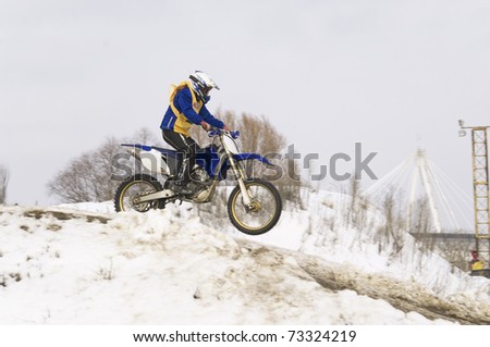 MOSCOW - FEBRUARY 28: Unrecognized sportsman on a second tour of motocross of Red Racing Group club on February 28, 2010 in Moscow, Krilatskoe, Russia