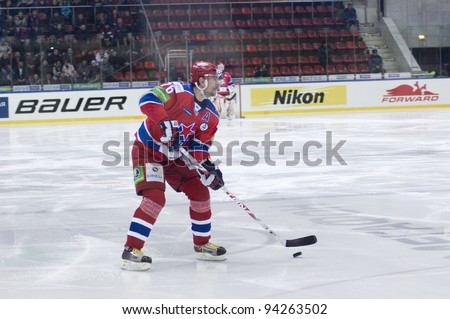 MOSCOW - JANUARY 31 : Alexander Guskov, defenceman with the puck during a hockey match \