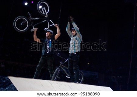 MOSCOW, RUSSIA - FEBRUARY 11: Unidentified bike trial riders compete at the festival of Extremals sports at Lugniki on February 11, 2012 in Moscow, Russia