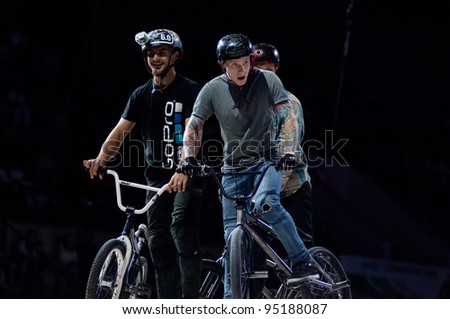 MOSCOW, RUSSIA - FEBRUARY 11: Unidentified bike trial riders  compete at the festival of Extremals sports at Lugniki on February 11, 2012 in Moscow, Russia