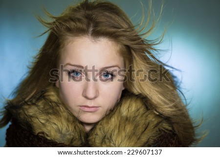 Portrait of the girl with a fur collar