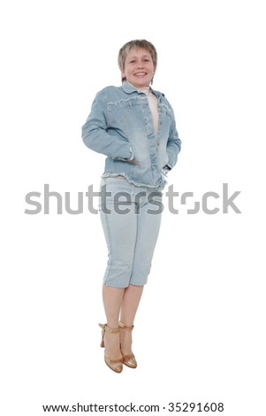 The woman in a jeans suit in a jump on a white background