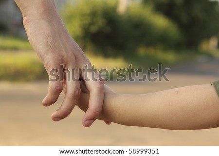 Man keeps hand a child