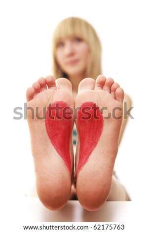 stock photo barefoot girl sits on foot is drawn heart barefoot girl