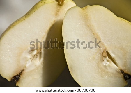 photo cloves pears, cut up for breakfast at the kitchen table in the light of day