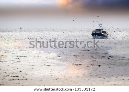 Tired fishing fleet getting back, France near the Atlantic ocean