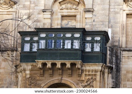 Typical anglo saxon wooden balcony in Malta