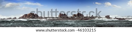 Rocky island in ar, in teh ocean, panorama of 6 images