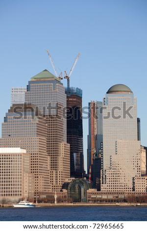 March 2011. Manhattan, lower New York financial offices(downtown) over Hudson river panorama from Jersey city. One World Trade Center building under construction