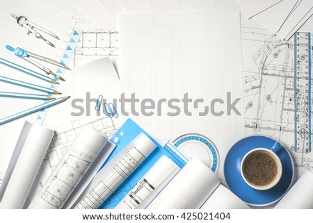 Workplace of architect - Architect rolls and plans.architectural plan,technical project drawing.  Engineering tools view from the top.  Construction background.