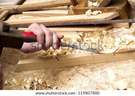carpenter working,hammer,meter and screw-driver on construction background. Copy space for text.
