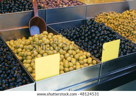 black and green olives on market stand