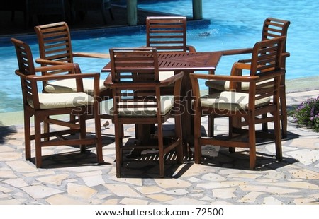 Furniture by the pool at a resort