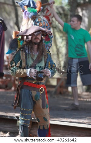 TAMPA FLORIDA- MARCH 13: A topped dress man stands for pictures at the Renaissance Festival on March 13, 2010 in Tampa, Florida