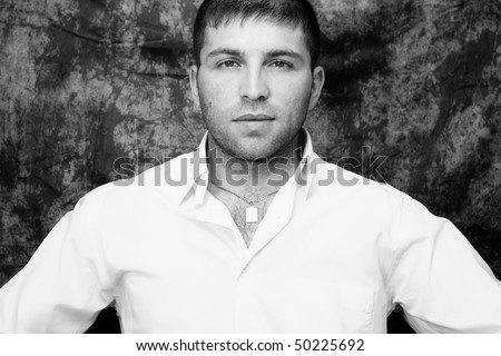 young handsome man black and white portrait, studio shot