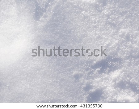 Fresh Winter Snow Texture Background - Top view texture of white fluffy snow crystals on the cold winter ground, Christmas background nature photo.