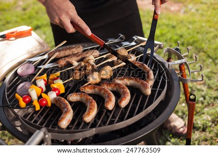 Fresh meat and vegetables grilled at a summer weekend barbecue