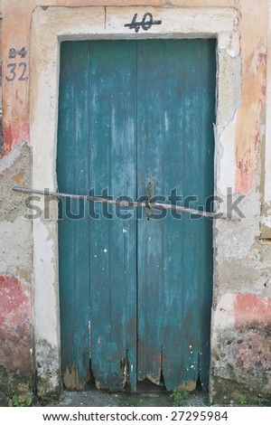 blue door with multiple numbers