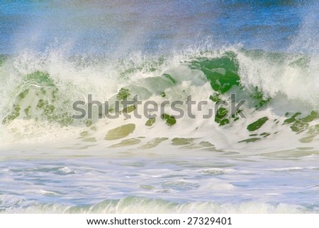 wave breaking with rainbow colors in spray