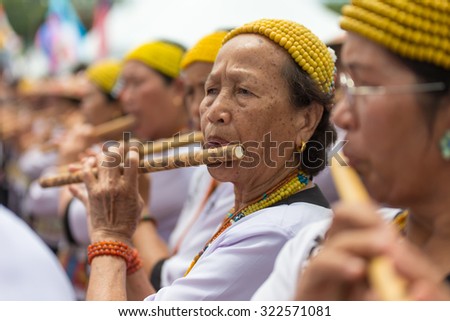 Sipitang, Sabah Malaysia.August 30, 2014 : Unidentified lady from Lundayeh tribe of Sabah Borneo playing traditional bamboo flute during folk festival in Sipitang Sabah Malaysia.
