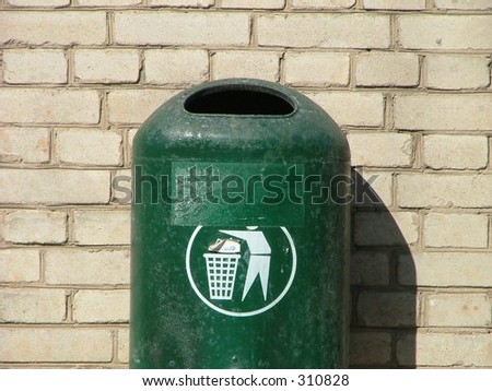 recycle bin attached to the wall