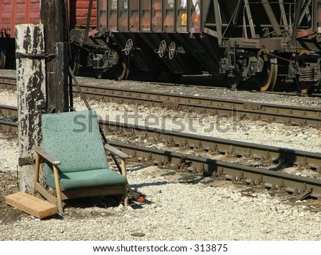 sad old armchair in the train station