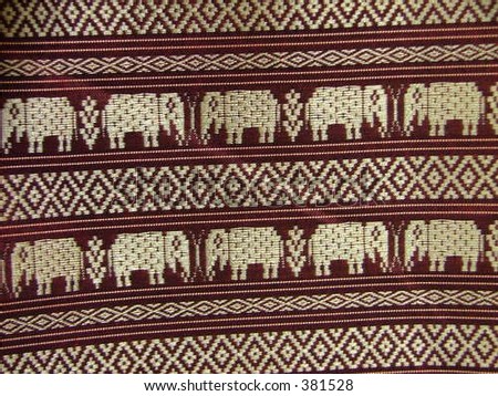 row of elephants on an oriental textile piece