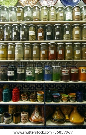 Jars of herbs and powders in a moroccan spice shop.
