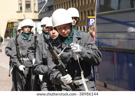 HELSINKI - JUNE 1: A small military parade in the central city where young recruits were marching through the city in full uniform and battle gear on June 1, 2007 in Helsinki, Finland.