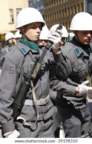 HELSINKI, FINLAND – JUNE 1: Young recruits in full uniform and battle gear get ready for military parade on June 1, 2007 in Helsinki.
