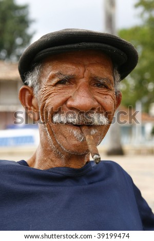 VINALES, CUBA - MARCH 19: A Cuban man smokes a cigar March 19, 2009 in Vinales, Cuba. Cubans of all ages are actively smoking cigars. All cigars production in Cuba is controlled by the government.