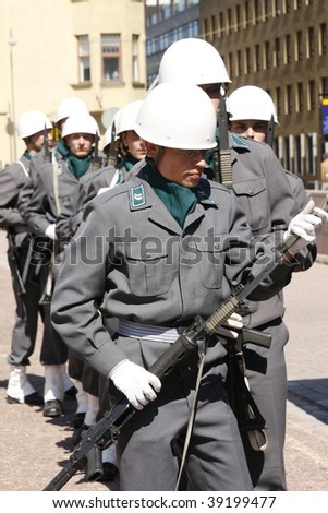 HELSINKI, FINLAND – JUNE 1: Young recruits in full uniform and battle gear get ready for military parade on June 1, 2007 in Helsinki.