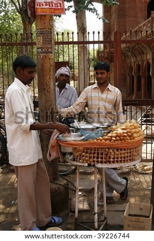 AGRA, INDIA - JUNE 17: Street vendors sell food June 17, 2007 in Agra, India. Most common health risks in India are hep B and typhoid, main source of contamination is unclean food.