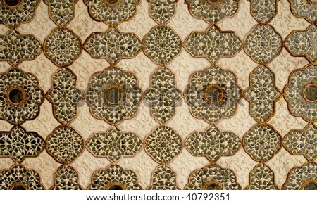 Patterned artwork in the ceiling in one of the Amber Fort palaces, India
