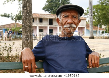 VINALES, CUBA - MARCH 19: Cuban man smoking a cigar on March 19, 2009 in Vinales, Cuba. Cubans of all ages are actively smoking cigars. All the production in Cuba is controlled by the Cuban government.
