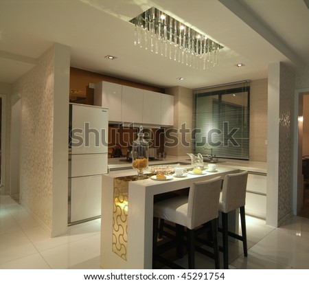 A dining room and kitchen in modern style.