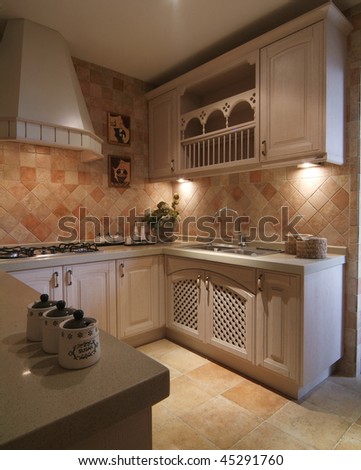 A finished kitchen with classic decoration.
