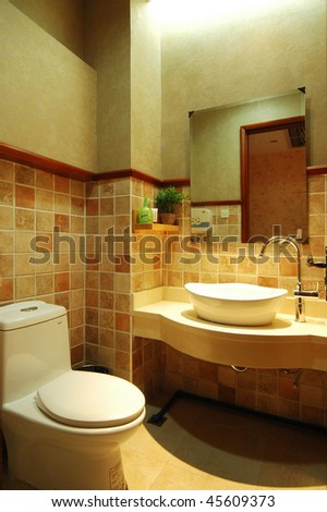 a simply decorated washroom with a lavatory and a wash stand