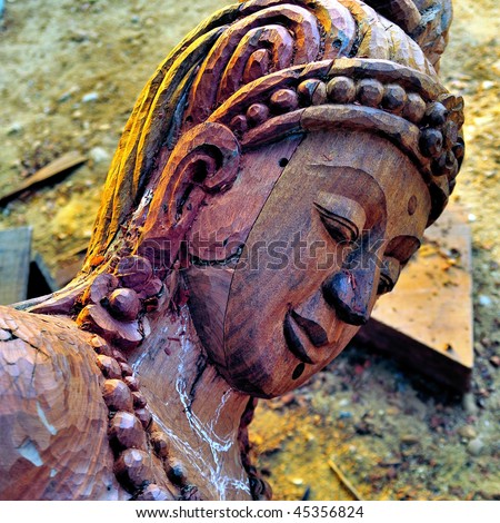 Wood carved head of a buddhist statue