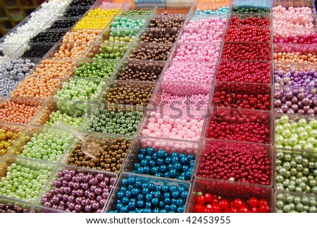 Multicolored beads in a in bijouterie shop for handmade accessories