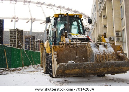 KIEV, UKRAINE-JANUARY 31: Heavy snow shower slows the construction works of Kyiv\'s Olympic stadium which is to be the main Ukraine\'s stage of Euro 2012. January 31, 2011, Kiev, Ukraine