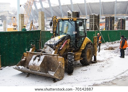 KIEV, UKRAINE-JANUARY 31: Heavy snow shower slows the construction works of Kyiv\'s Olympic stadium which is to be the main Ukraine\'s stage of Euro 2012. January 31, 2011, Kiev, Ukraine