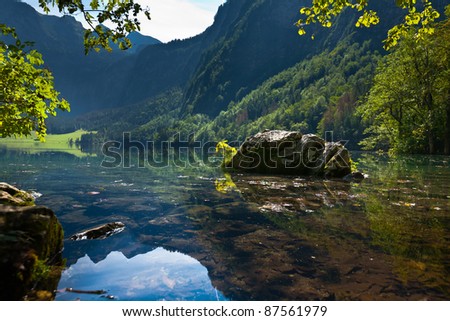 View of the lake. Transparent bottom. Boulders.