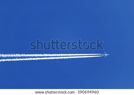 Airplanes leaves trace on clear blue sky. The trace called contrails, condensation trails or vapor trails, prouced by the aircraft engine exhaust, composed primarily of water, in form of ice crystals.