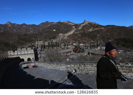 BADALING, CHINA - CIRCA JANUARY 2013. Man walking on the Great Wall of China in Badaling near Beijing on January 2013. The Great Wall of China is the longest man-made structure in the world.