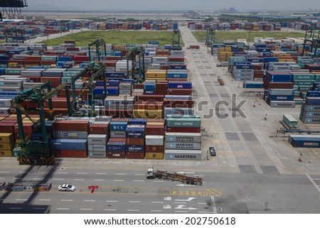 GUANGZHOU, CHINA - JUNE 26.:Containers in Nansha port preparing to be loaded to ships in Guangzhou, Guangdong province, China on 26. June 2014.