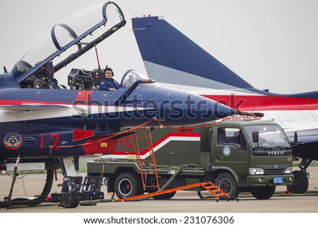 ZHUHAI, CHINA - NOV. 10. 2014:Pilots preparing Chinese J-10 airplane for flight on Airshow China 2014 in Zhuhai, Guangdong province.
