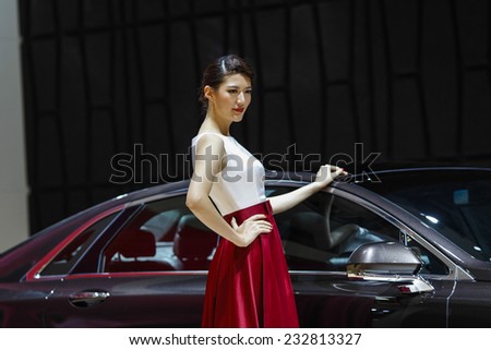 GUANGZHOU, CHINA - NOV. 22. 2014: Model posing during the 12th China International Automobile Exhibition in Guangzhou, Guangdong province.