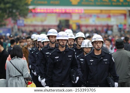 GUANGZHOU, CHINA - FEB. 14. 2015: Police patrols on Gunagzhou Main Railway Station plateau in Guangzhou, Guangdong province.